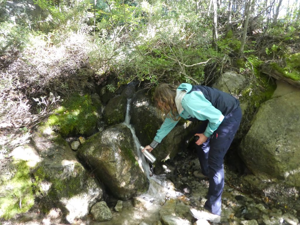 Getting water from a water source at Torres del Paine