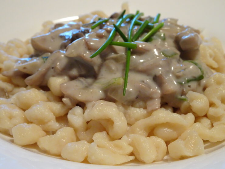 Authentic German Spätzle (engl. spaetzle) with mushroom cream sauce